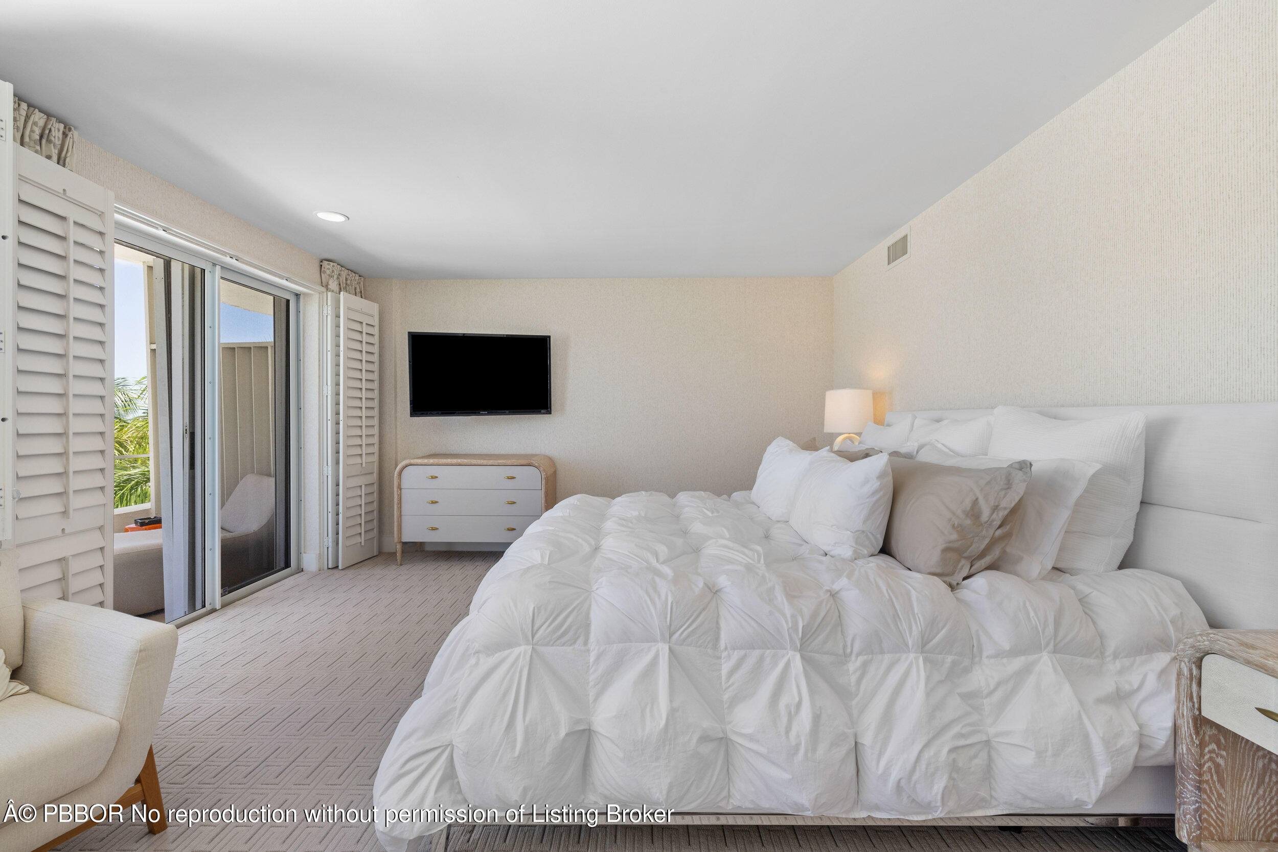 44 Cocoanut Row, Unit 510B & 511B Palm Beach, FL 33480 - Photo 17 of 24 a bedroom with a bed and a flat screen tv