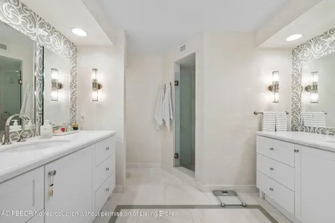 a bathroom with a double vanity sink mirror and double