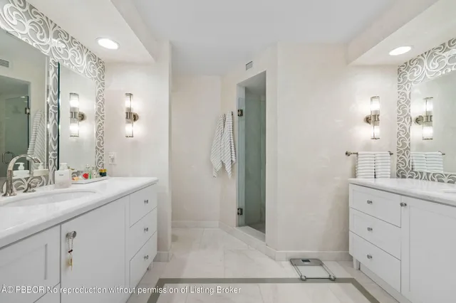 a bathroom with a double vanity sink mirror and double