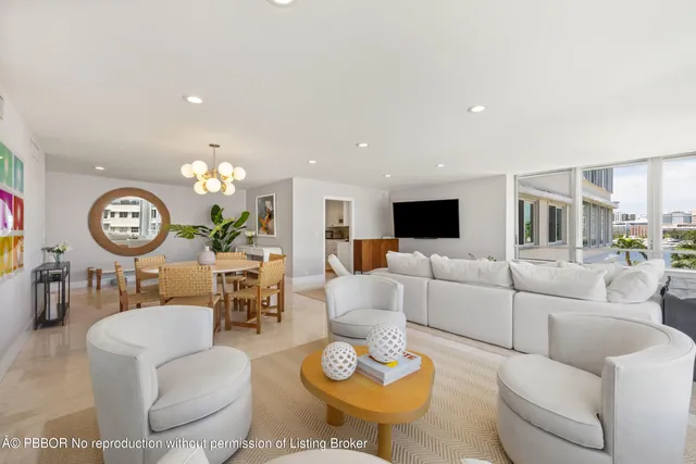 a living room with furniture a rug and a fireplace