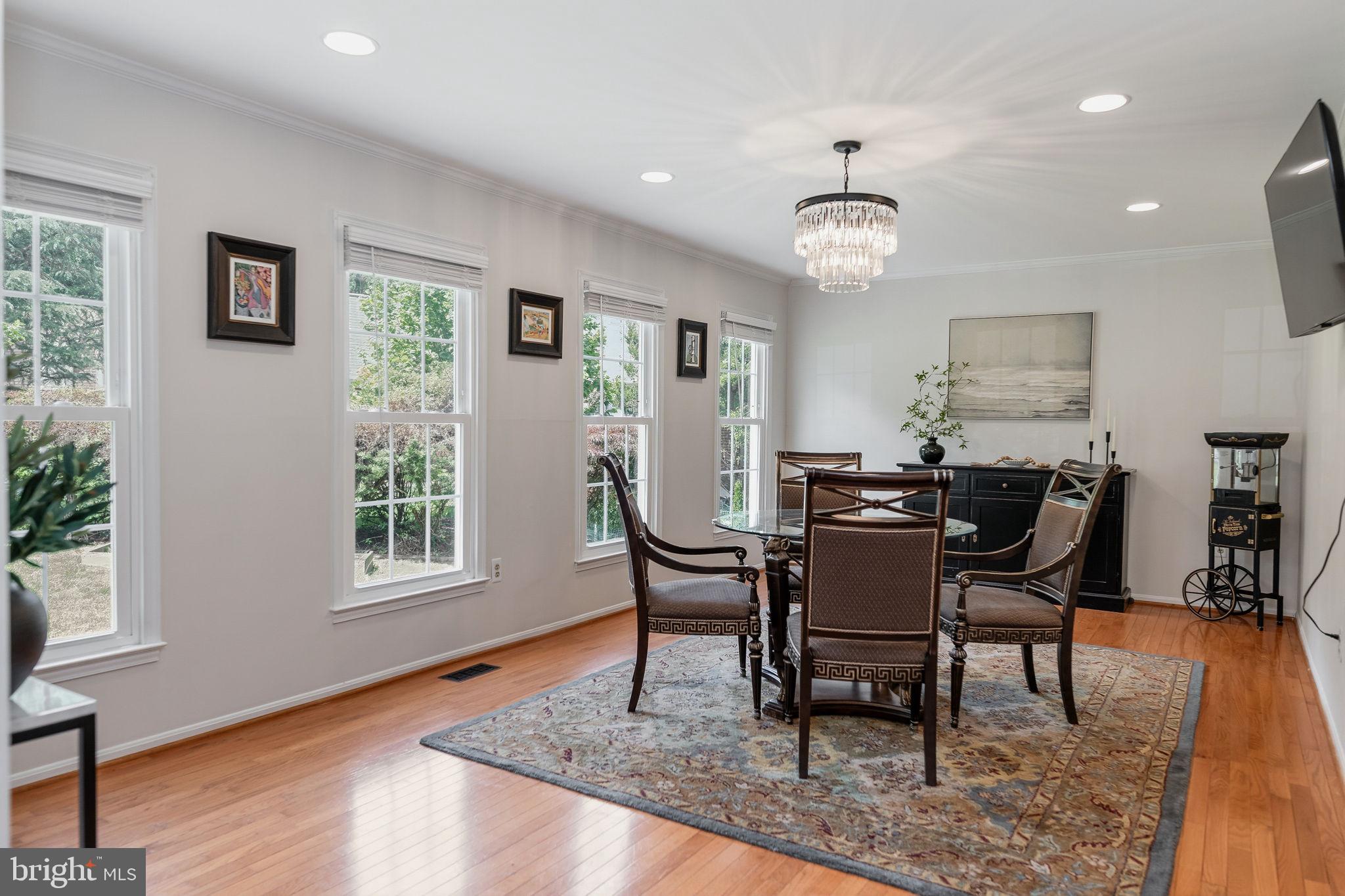 7603 Modisto Lane Springfield, VA 22153 - Photo 6 of 57 a view of a dining room with furniture window and wooden floor
