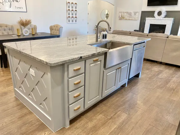 a kitchen with stainless steel appliances a sink a stove and a refrigerator
