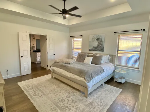 a bedroom with a bed and a dresser