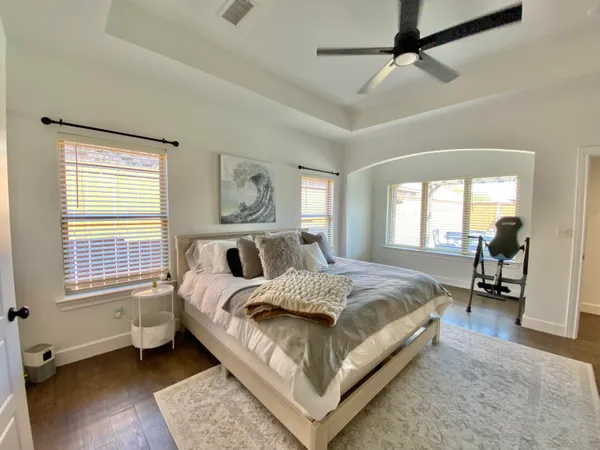 a bed room with a bed and a chair