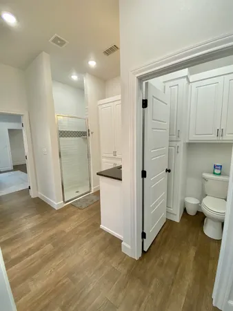 a bedroom with a bed and a chair