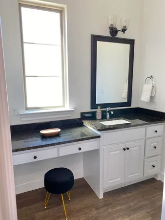 a bedroom with a bed and a wall painting