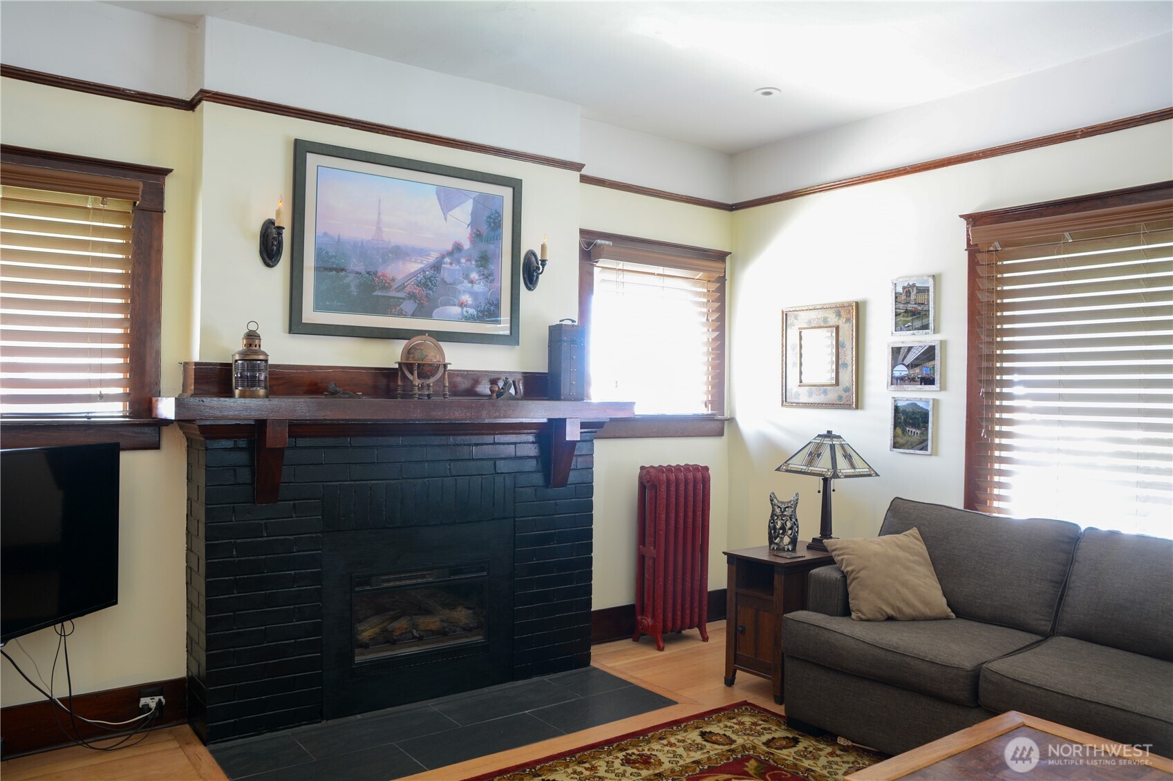 202 East 3rd Avenue Ritzville, WA 99169 - Photo 19 of 40 a living room with furniture a flat screen tv and a fireplace