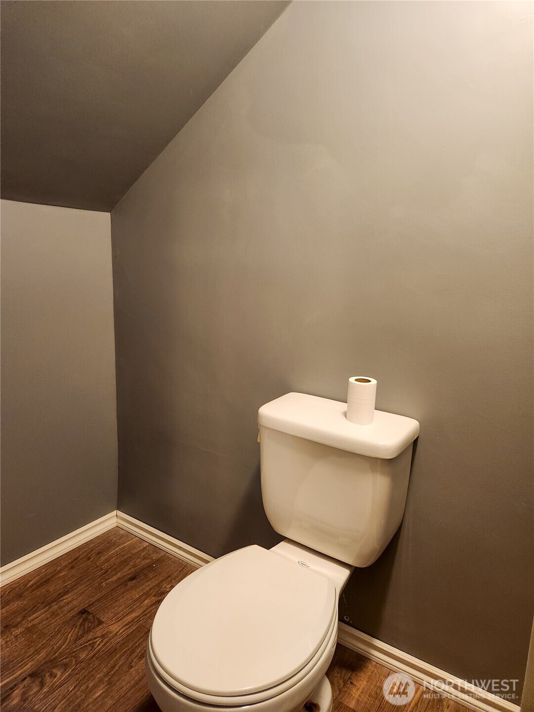 202 East 3rd Avenue Ritzville, WA 99169 - Photo 24 of 40 a white toilet sitting next to a bathroom sink