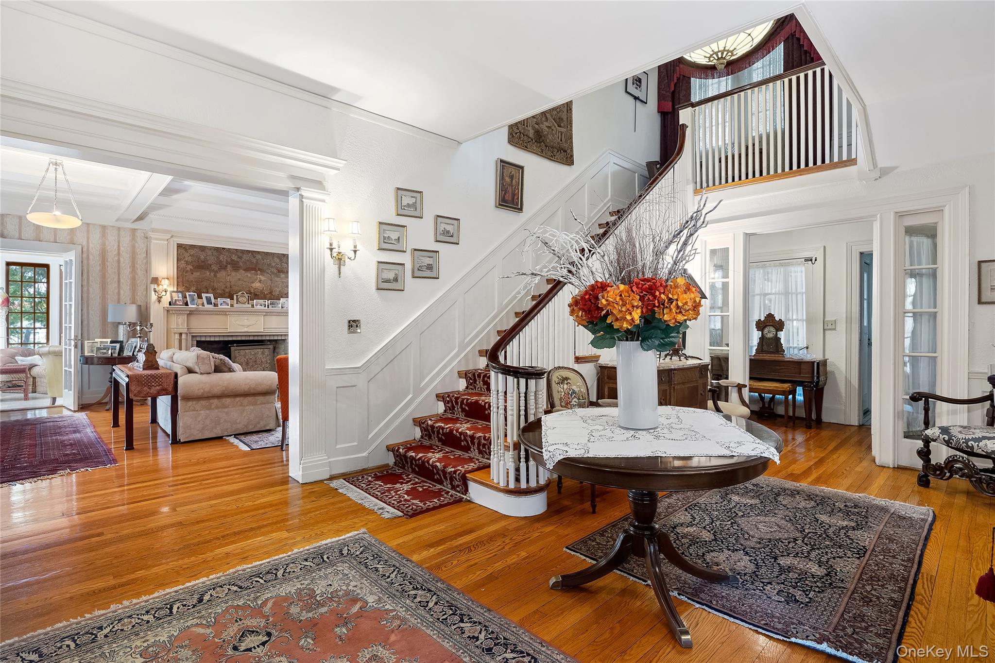 1-27 Beverly Road Queens, NY 11363 - Photo 23 of 46 a living room with furniture and a rug