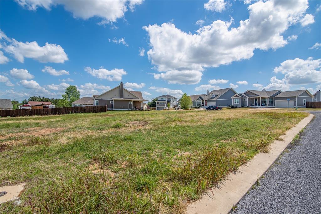 11 Willow Tree Lane Pottsboro, TX 75076 - Photo 2 of 9 a view of a house with a big yard and large trees