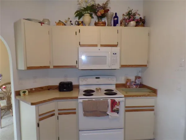 a kitchen with a cabinets and a stove top oven