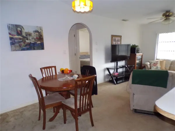 a dining room with furniture and a fireplace
