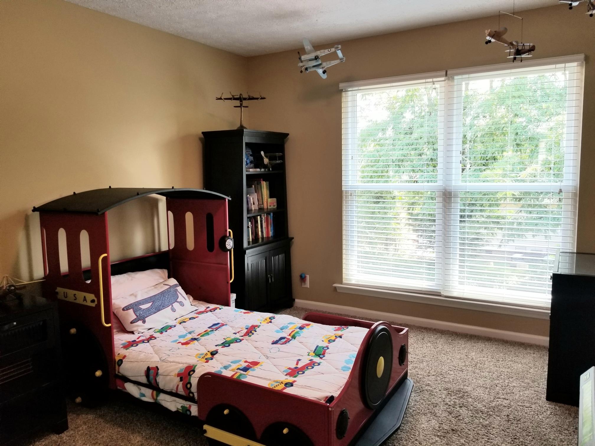 5249 Ridgefalls Way Antioch, TN 37013 - Photo 13 of 23 a bedroom with a bed and a window