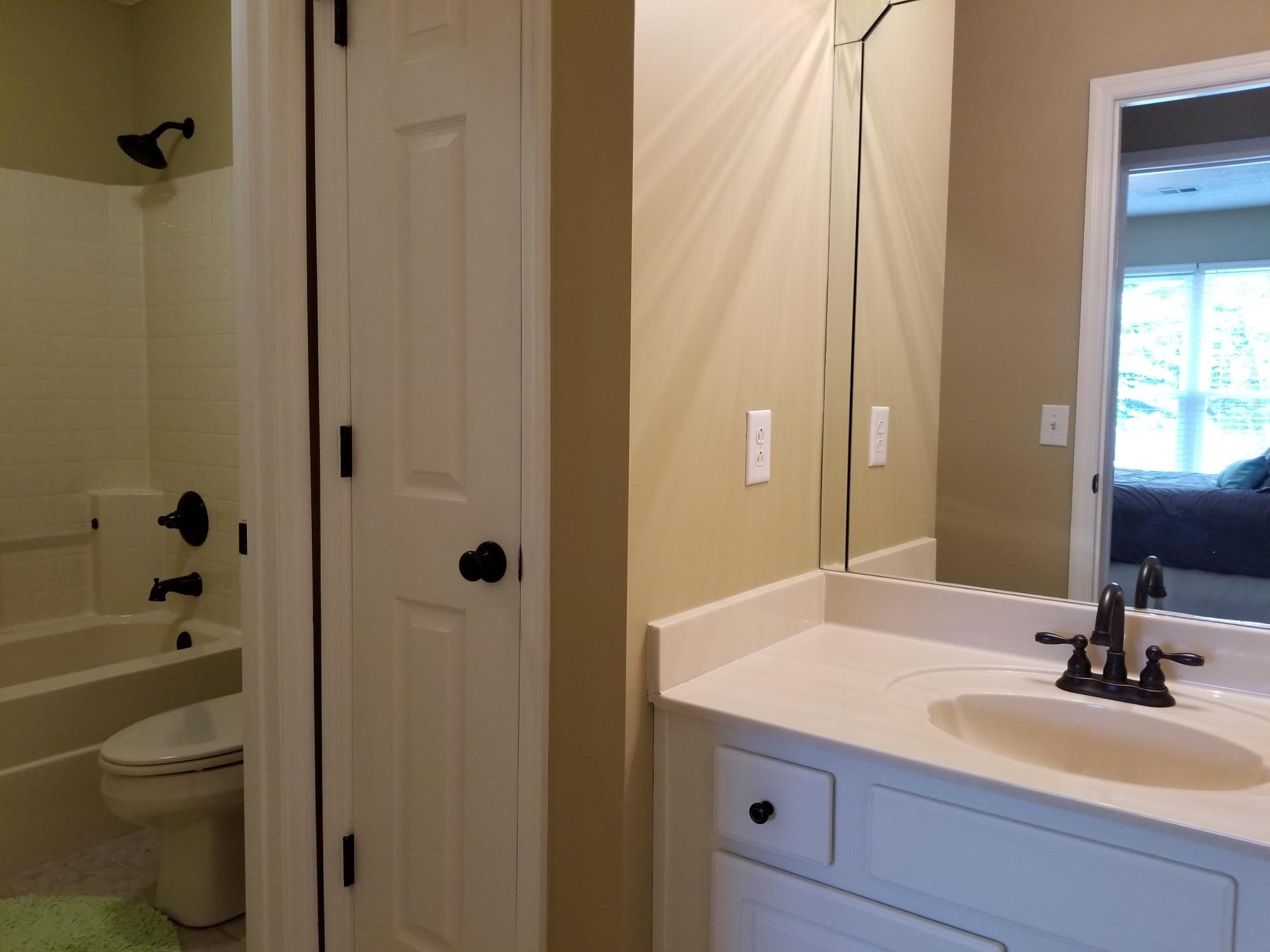 5249 Ridgefalls Way Antioch, TN 37013 - Photo 14 of 23 a bathroom with a granite countertop sink a toilet and shower