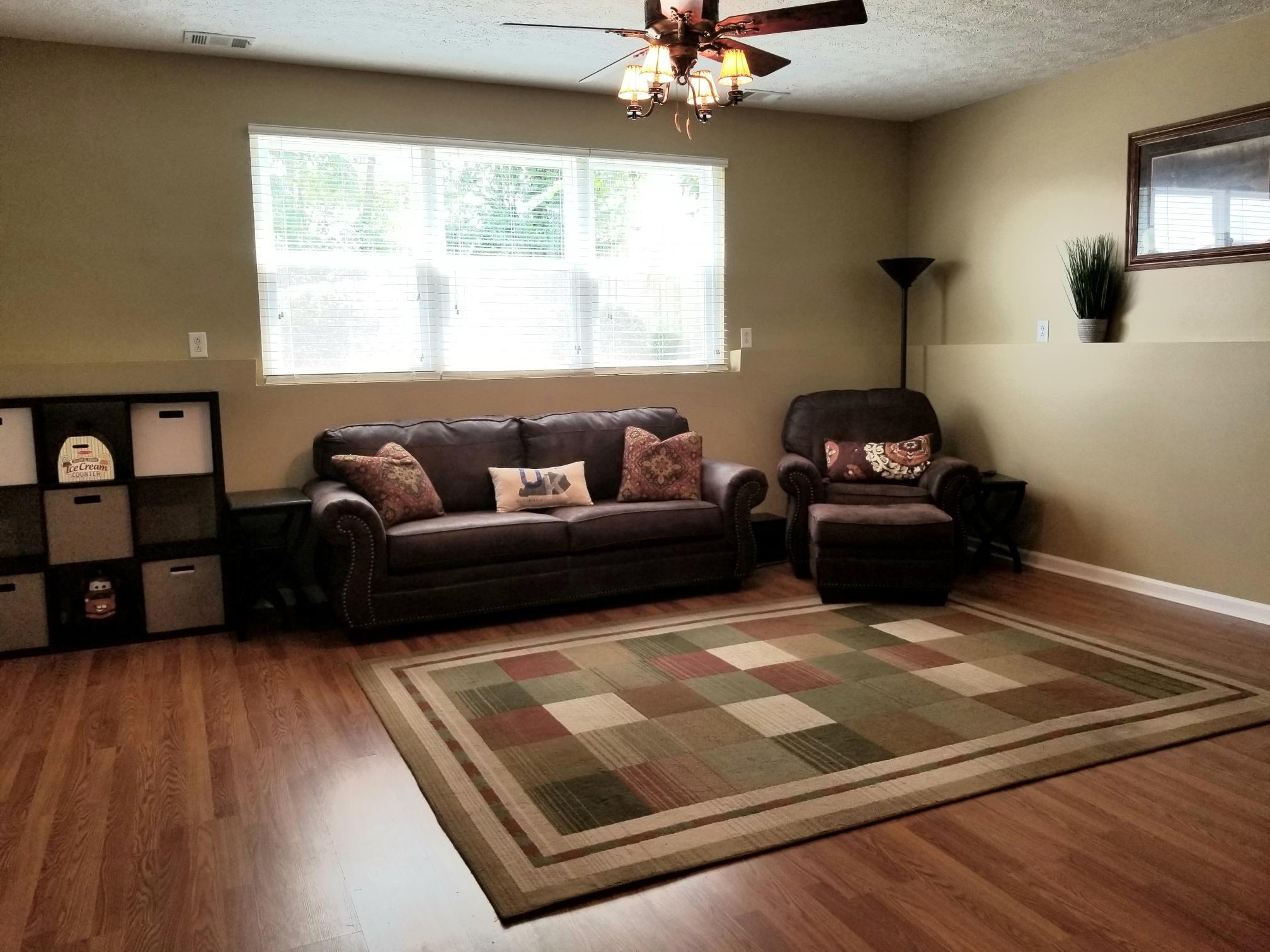 5249 Ridgefalls Way Antioch, TN 37013 - Photo 19 of 23 a living room with furniture and a flat screen tv