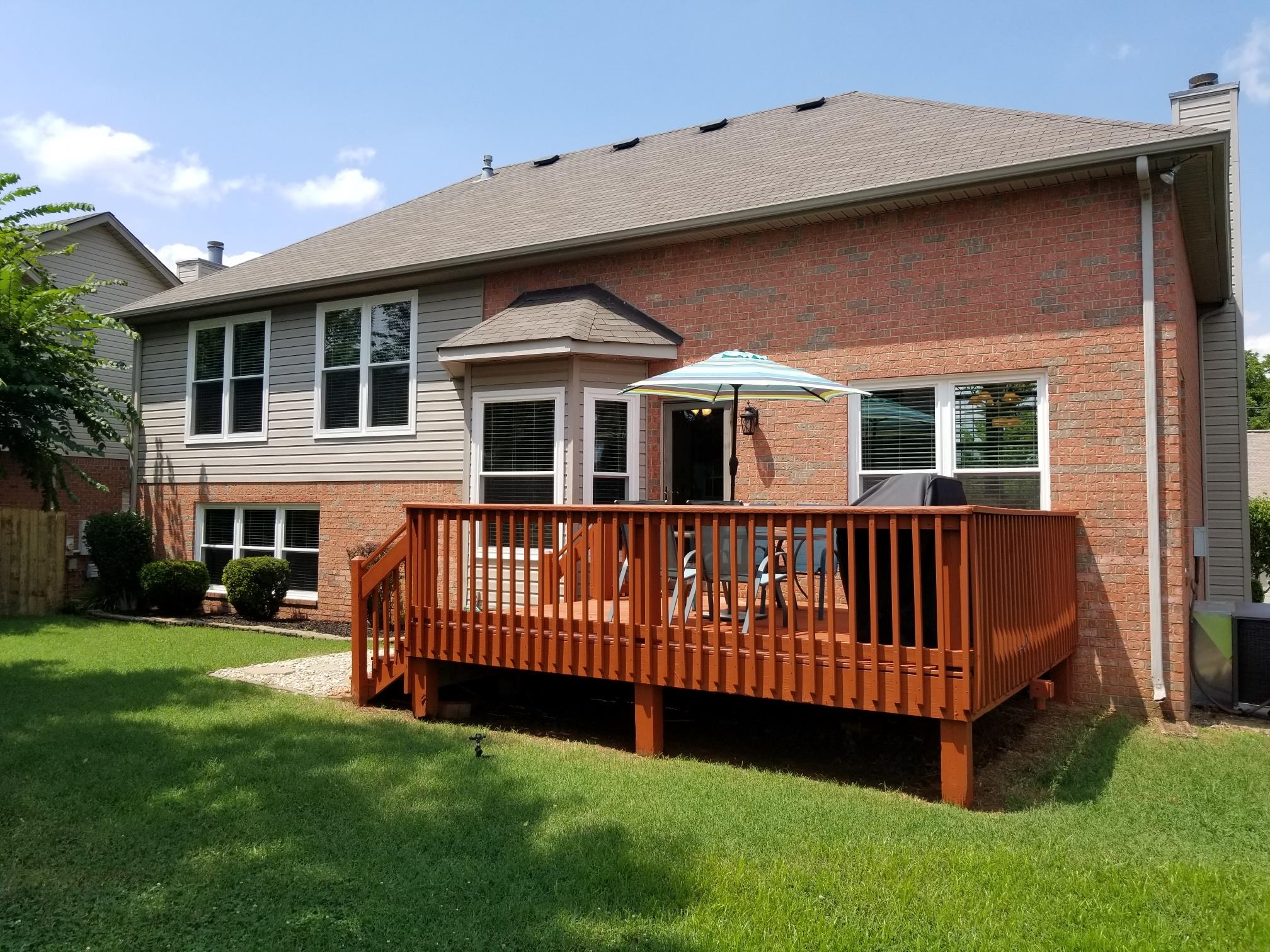 5249 Ridgefalls Way Antioch, TN 37013 - Photo 21 of 23 a view of a house with a yard and deck