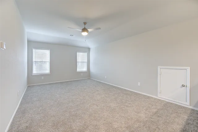 a view of empty room with windows