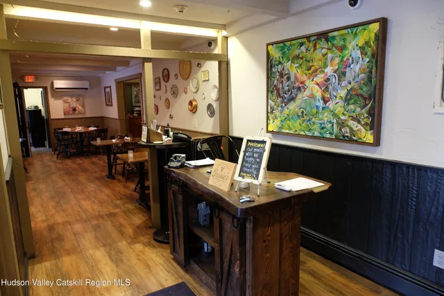 a dining room with large window