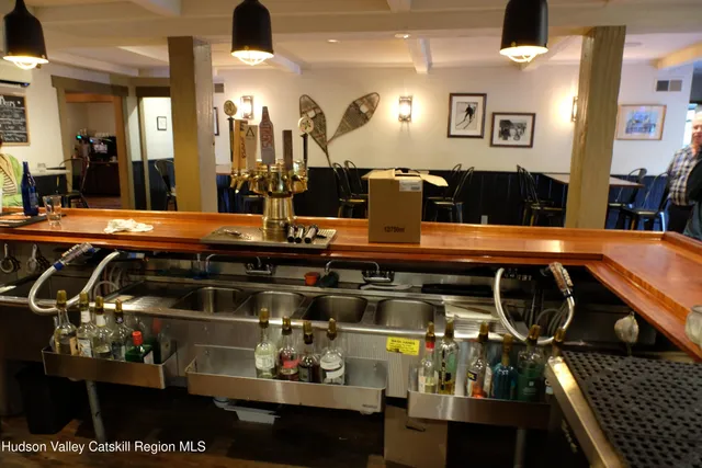 a kitchen with stainless steel appliances kitchen island granite countertop a stove and cabinets