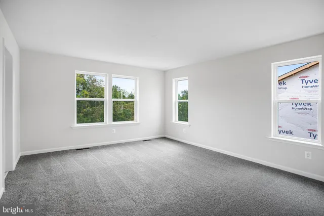 an empty room with windows