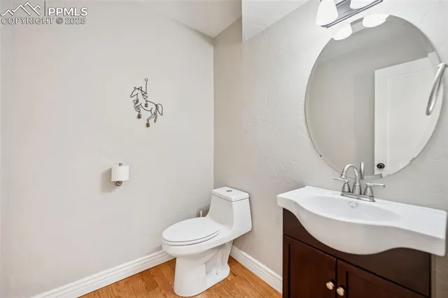 a bathroom with a sink mirror and toilet