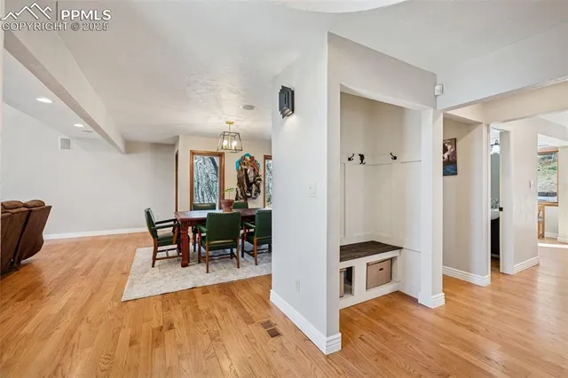 a view of a dining room with furniture and wooden floor
