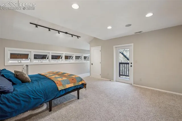 a bedroom with furniture and a window