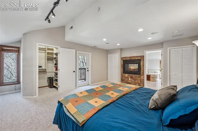 a bedroom with a bed and a table in it