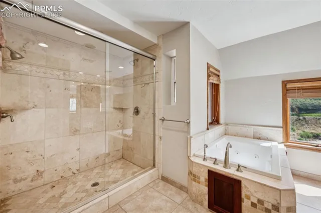 a bathroom with a bathtub and a shower