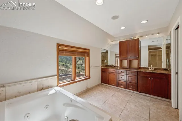 a large bathroom with a large tub and sink