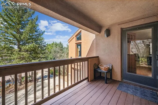 a view of a two chairs in the balcony