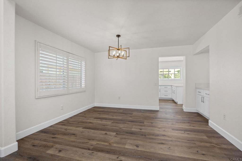 4595 Blackwell Road Oceanside, CA 92056 - Photo 7 of 47 wooden floor in an empty room with a window