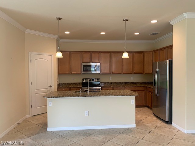 8976 Water Tupelo Road Fort Myers, FL 33912 - Photo 12 of 35 a large kitchen with stainless steel appliances granite countertop a stove a sink a refrigerator and a microwave