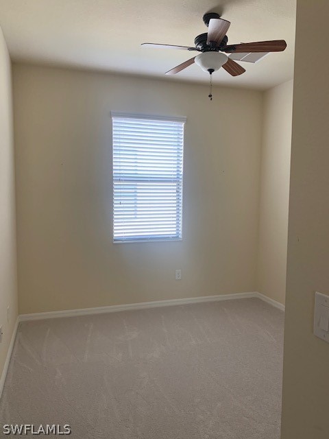 8976 Water Tupelo Road Fort Myers, FL 33912 - Photo 13 of 35 an empty room with a window and a fan