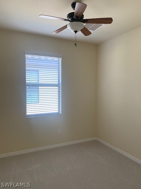 8976 Water Tupelo Road Fort Myers, FL 33912 - Photo 16 of 35 an empty room with a window and a fan