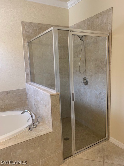 8976 Water Tupelo Road Fort Myers, FL 33912 - Photo 18 of 35 a bathroom with a bathtub and shower