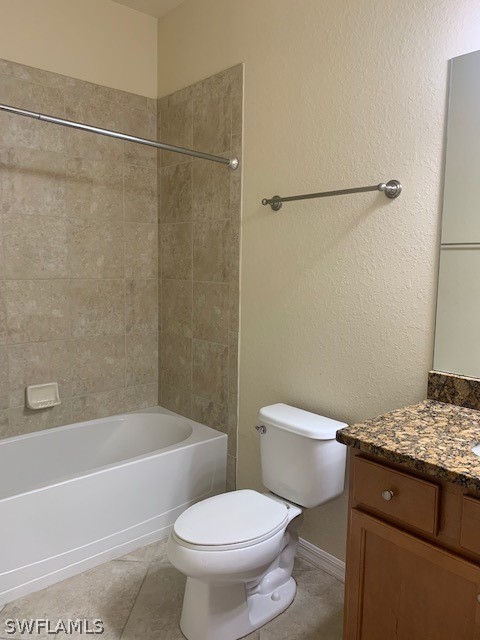 8976 Water Tupelo Road Fort Myers, FL 33912 - Photo 20 of 35 a white toilet sitting next to a bath tub
