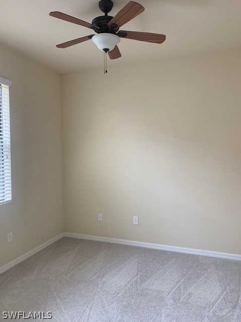 8976 Water Tupelo Road Fort Myers, FL 33912 - Photo 21 of 35 an empty room with a window and a fan