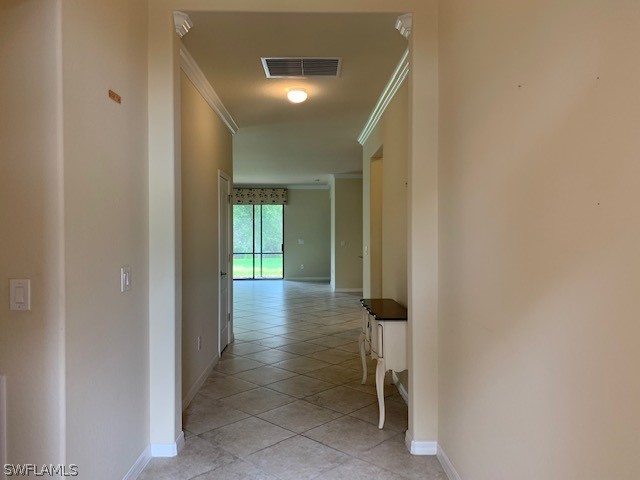 8976 Water Tupelo Road Fort Myers, FL 33912 - Photo 23 of 35 a view of a hallway with wooden shelves