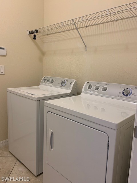 8976 Water Tupelo Road Fort Myers, FL 33912 - Photo 25 of 35 a utility room with dryer and washer