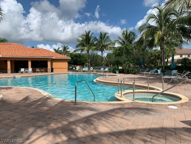 8976 Water Tupelo Road Fort Myers, FL 33912 - Photo 28 of 35 a view of a house with swimming pool and sitting area