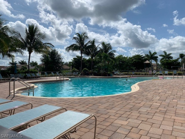 8976 Water Tupelo Road Fort Myers, FL 33912 - Photo 29 of 35 a view of a lake with a yard