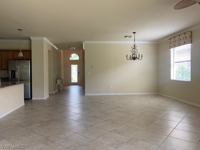 8976 Water Tupelo Road Fort Myers, FL 33912 - Photo 10 of 35 a view of a hallway with wooden floor and a living room