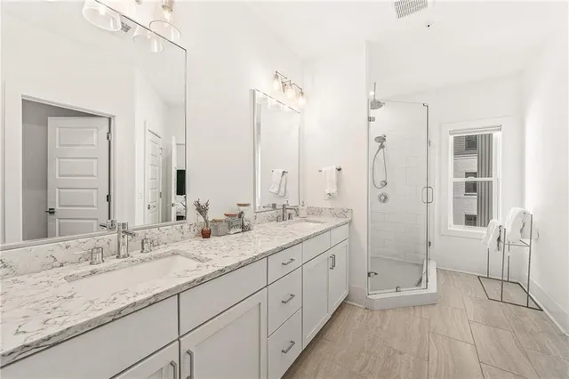 a view of walk in closet with clothes