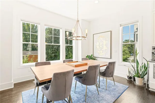 a view of a dining room with furniture window and outside view