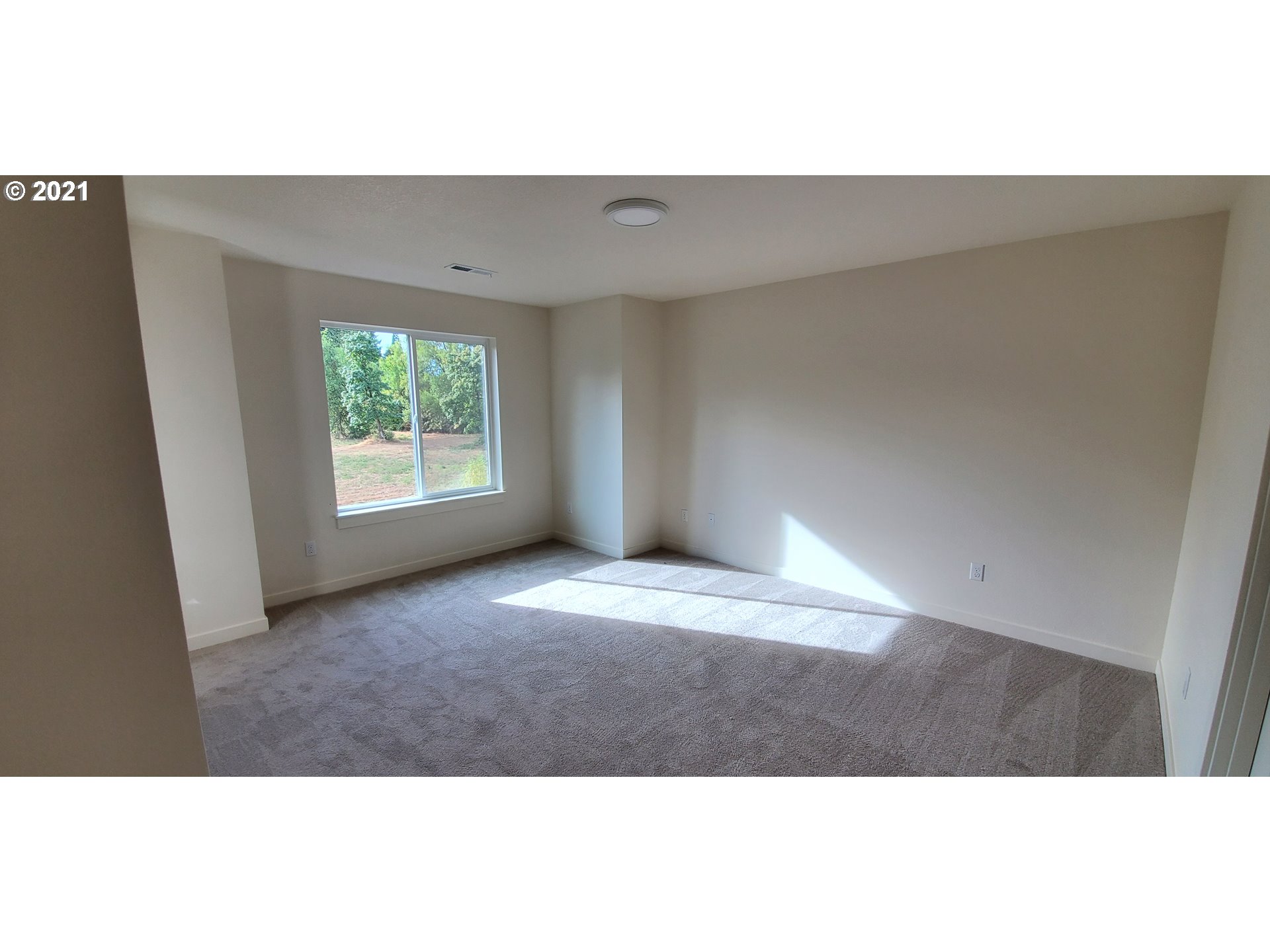 1227 South Union Place Ridgefield, WA 98642 - Photo 3 of 8 a view of an empty room with a window