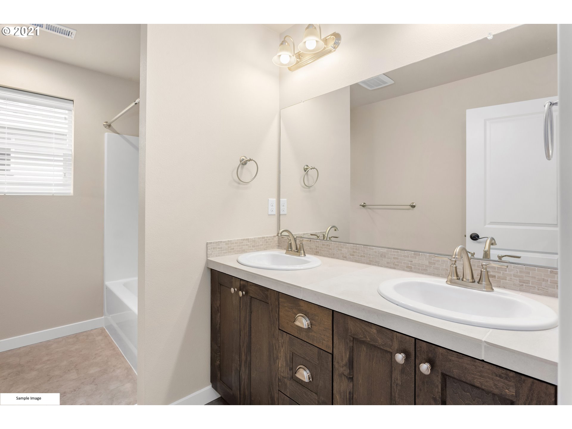 1227 South Union Place Ridgefield, WA 98642 - Photo 6 of 8 a bathroom with a sink and a mirror