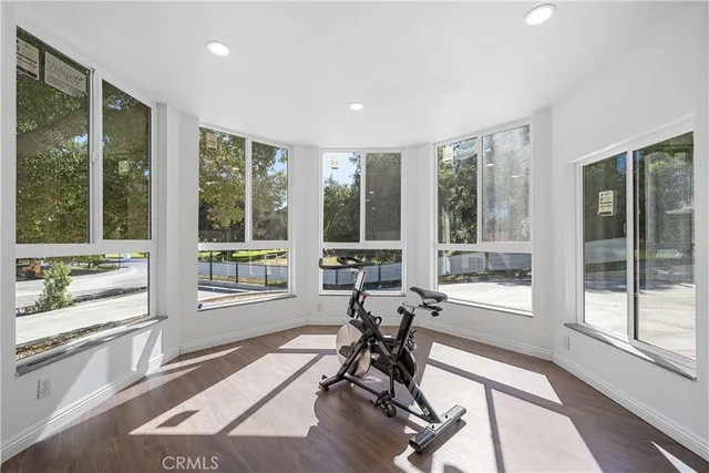 a view of a room with chair and windows