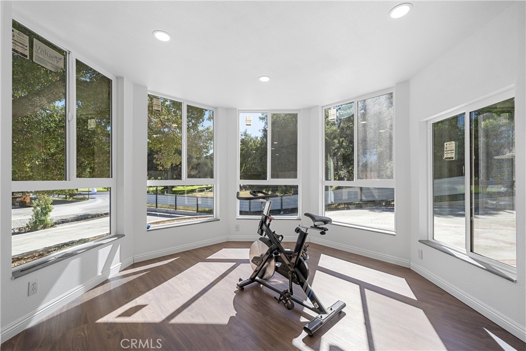 26251 Ravenhill Road Canyon Country, CA 91387 - Photo 11 of 64 a view of a room with chair and windows