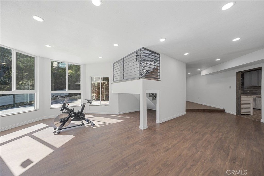 26251 Ravenhill Road Canyon Country, CA 91387 - Photo 12 of 64 a view of a room with gym equipment and windows